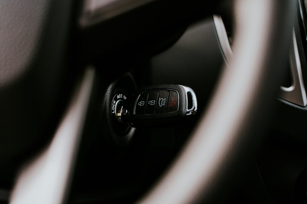 Car Key on a Hole in Close-up Photography